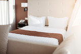 Fototapeta  - Interior of a luxury double bed hotel bedroom