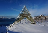 Fototapeta Do pokoju - codfish rack building is landmark landscape on snow and blue sky background in norway travel