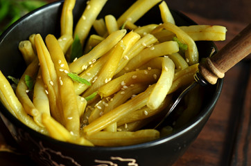 Yellow beans in black bowl