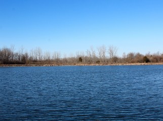 A view of the lake on a beautiful sunny day.