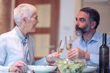 Wall Mural - Mature cople having lunch at home