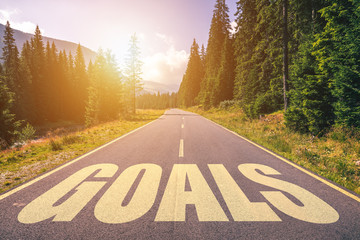 Wall Mural - Goals word written on road in the mountains