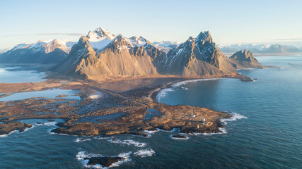 mountains and ice lagoon jokulsarlon has become one of iceland's most popular attractions due to its