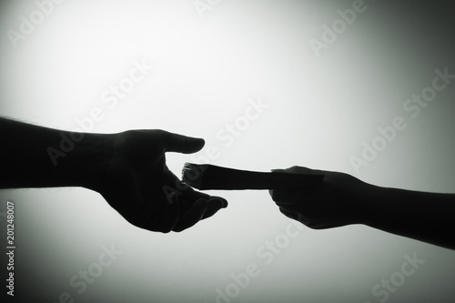 Fotomural dark economy. Two hands with money