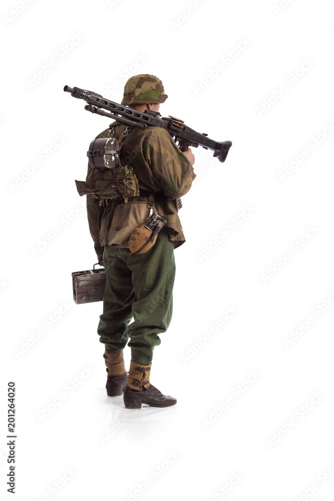 Man actor in the movie role of an old military man with a MG 42 machine ...