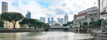 Singapore, Panoramic View From River Bank To Cavenagh Bridge With Down-town Skyscrapers In Background