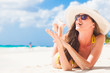 © el.rudakova - woman in bikini and straw hat relaxing on tropical beach