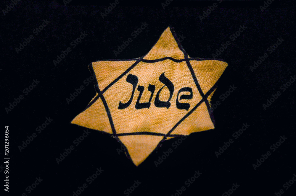 Jews throughout Nazi-occupied Europe were forced to wear badges to identify themselves. - obrazy, fototapety, plakaty 