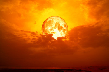 full blood moon back silhouette dark red cloud in sea