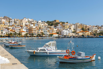 Wall Mural - Seaport of Sitia town with moored traditional Greek fishing boat