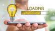 © sdecoret - Businessman holding loading sketch over mobile phone