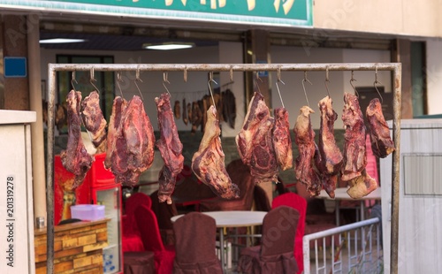 Cuadros en Lienzo Meat for slaughter hanging on the street (Kunming, Yunnan, China)
