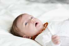 3 Month Old  Beautiful, Cute Baby With Amber Necklace