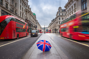 Sticker - London, England - British umbrella at busy Regent Street with iconic red double-decker buses and black taxies on the move