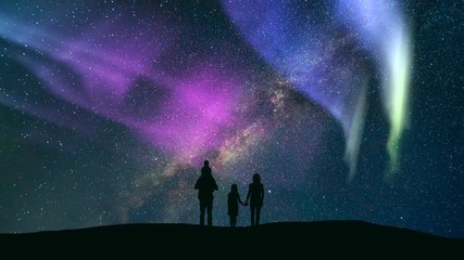 Wall Mural - The family standing against a starry sky with a northern light. time lapse