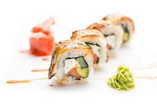Seductive Sushi Rolls With Eel, Avocado And Cucumber And Philadelphia Cheese. Isolated. Sushi Roll On A White Background.