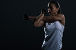© LIGHTFIELD STUDIOS - attractive muscular sportswoman stretching arm, isolated on black
