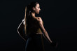 © LIGHTFIELD STUDIOS - beautiful female bodybuilder posing and showing muscles, isolated on black