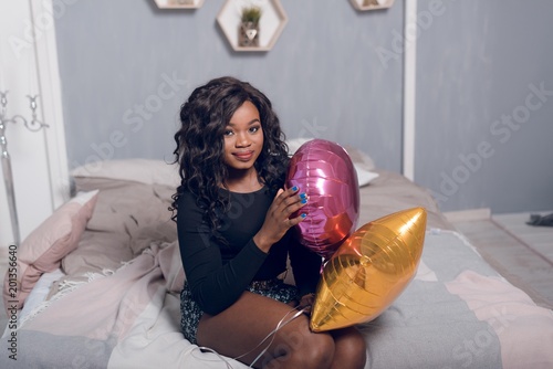 Portrait Shot Of A Cute Young African American Woman With Curly