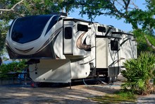 Camper Trailer Parked At Campsite