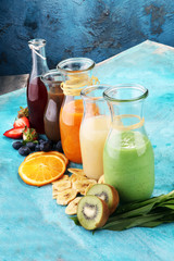 Wall Mural - Selection of colorful smoothies on rustic background