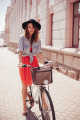 Wall Mural - Woman with bike on the street