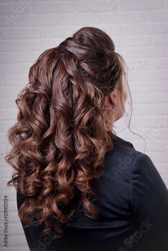 Hairstyle Long Curls On The Head Of A Brunette Look Right Against