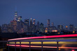 Lower Manhattan skyline with light streams in foreground