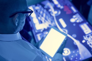 Man holding using tablet in a technology meeting