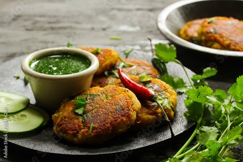 Aloo Tikki /Potato Patties served with cilantro chutney - Buy this ...