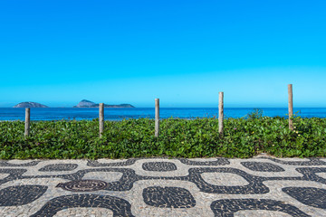 Fototapete - Famous Ipanema Sidewalk Mosaic and Ocean in the Horizon, Rio de Janeiro, Brazil