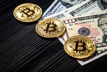 Golden Bitcoin On Money Bills Background