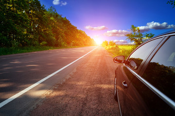 Wall Mural - Car on asphalt road in summer