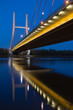 The Siekierkowski Bridge in Warsaw reflecting at night in the Vistula River