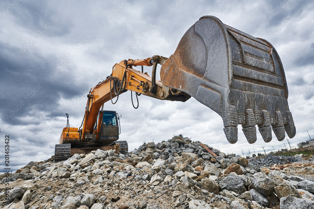 excavator loader machine at demolition construction site - obrazy, fototapety, plakaty 