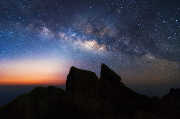 Wall Mural - milky way galaxy and mountain landscape.
