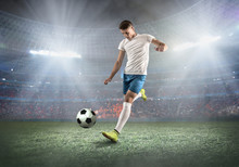 Soccer Player On A Football Field In Dynamic Action At Summer Da
