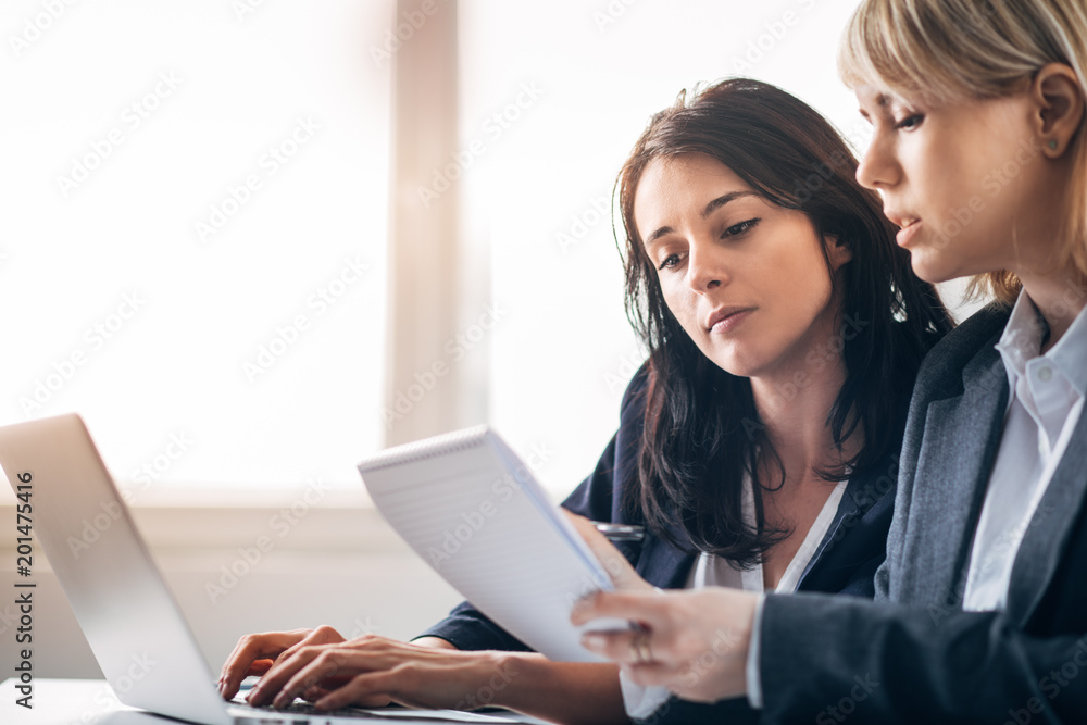 Colleagues working in office