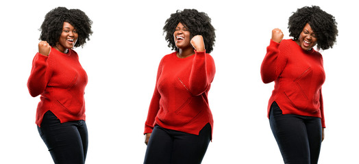 Wall Mural - Young beautiful african plus size model happy and excited expressing winning gesture. Successful and celebrating victory, triumphant isolated over white background. 