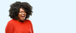 Beautiful african woman stressful, terrified in panic, shouting exasperated and frustrated. Unpleasant gesture. Annoying work drives me crazy, blue background