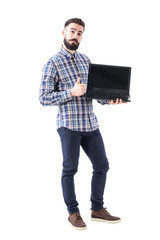 happy funny bearded guy with blank open laptop screen showing thumb up gesture. full body isolated o