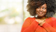 © Krakenimages.com - Beautiful african woman with hands in heart, expressing love and health concept, outdoor