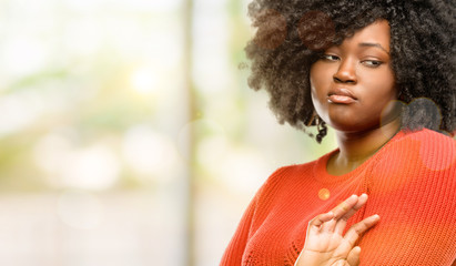 Poster - Beautiful african woman irritated and angry expressing negative emotion, annoyed with someone, outdoor