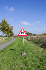 Traffic Signs / Germany: Temporary warning sign „Two way traffic ahead“ on a small rural road in Eastern Thuringia