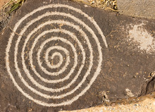 Spiral Circle Of Life Petroglyph. Ancient Pueblo Etching Located At Petroglyph National Monument, Albuquerque, New Mexico.
