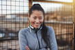 © Flamingo Images - Sporty young Asian woman standing outside before a run