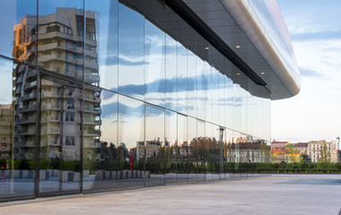 Canvas Print - Milan cityscape: new modern buildings reflected in a large shop window in a residential and business district.