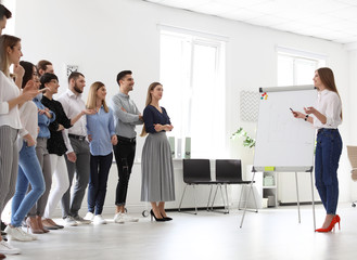 Wall Mural - Female business trainer giving lecture in office