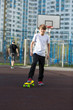 © Natali - cute young sport boy skating on yellow skateboard and has a good time on his free time on weekend, holidays. healthy sport lifestyle concept for kids