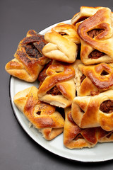 Sticker - Buns with raisins and jam on a black background